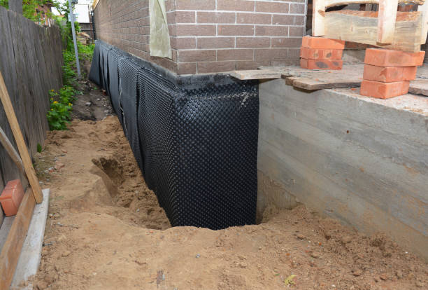 Happy homeowners after waterproofing job in Mumford